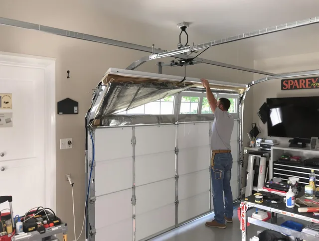 Garage door section replacement by Norton Garage Door Repair in Norton